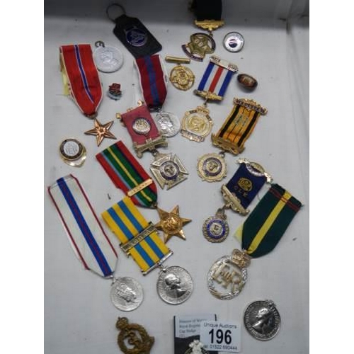 196 - A mixed lot of 20th century medals etc.,