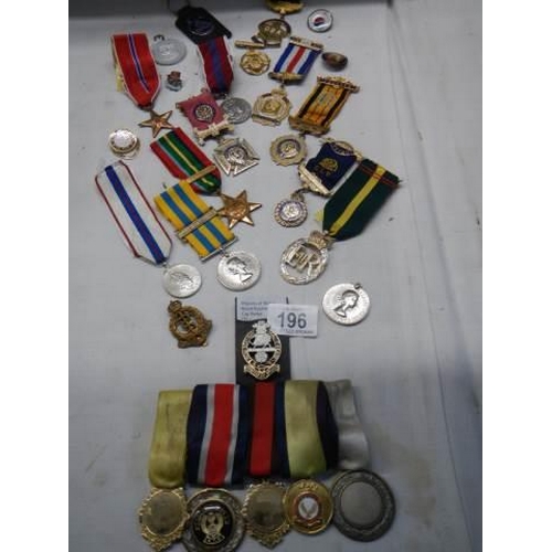 196 - A mixed lot of 20th century medals etc.,