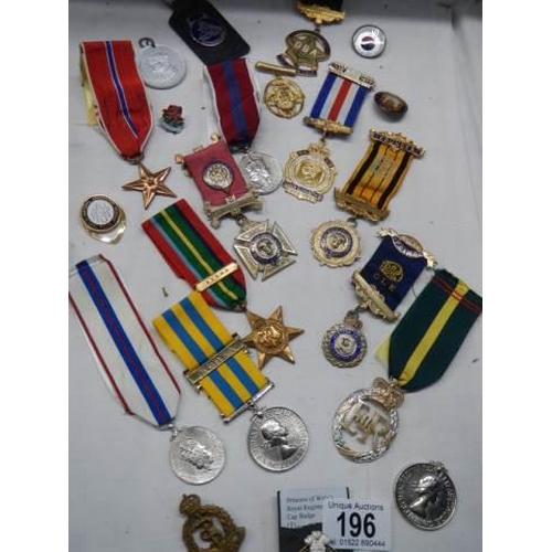 196 - A mixed lot of 20th century medals etc.,