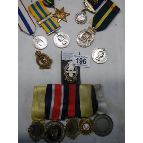 196 - A mixed lot of 20th century medals etc.,