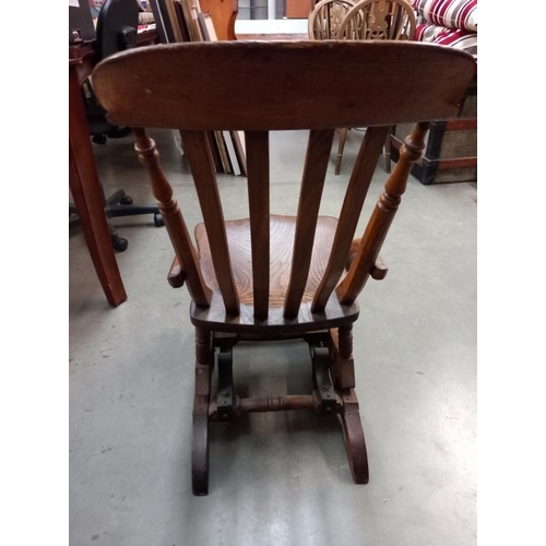 630C - A Windsor style rocking chair, COLLECT ONLY.