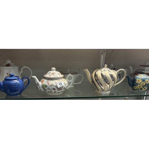 13 - A quantity of collectable teapots including Chinese, Sadler etc