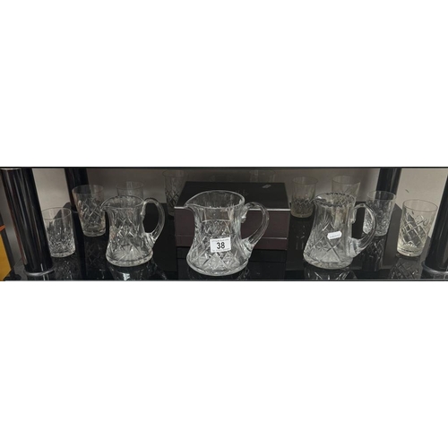 38 - A quantity of cut-glass jugs & glasses