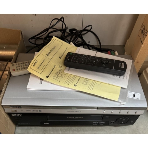 9 - A VCR & DVD player with remote controls & manuals