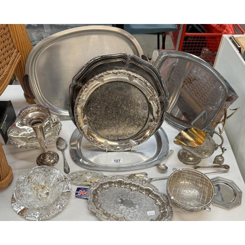 107 - A quantity of metalware, mainly silver including plates, trays, utensils, vase etc