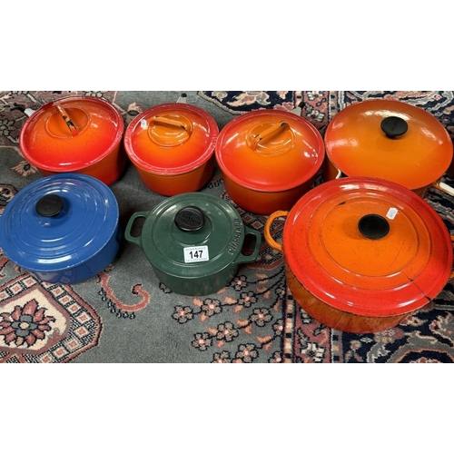 147 - A large cast iron casserole pot, A Chasseur casserole pot, A Creuset saucepan in blue & 4 saucepans ... 