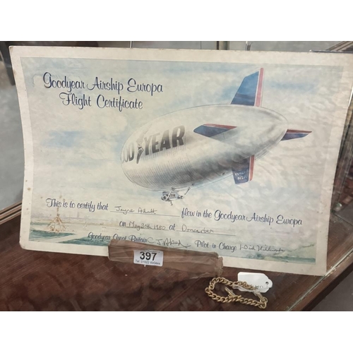 397 - A large goodyear airship flight certificate dated 1980 with yellow metal bracelet with goodyear airs... 