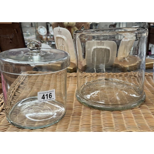 416 - Two large glass jars, one lidded