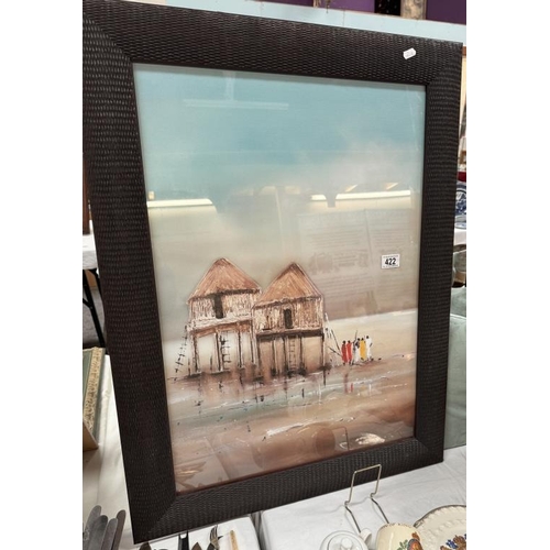 422 - A glazed African waterside hut scene with wicker effect frame. 64 x 85cm