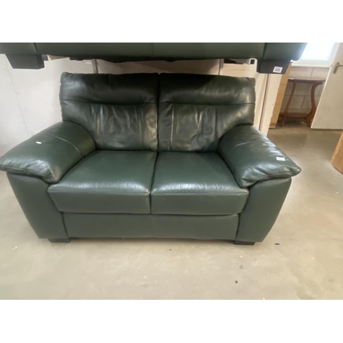 431 - A green leather 2 seat settee