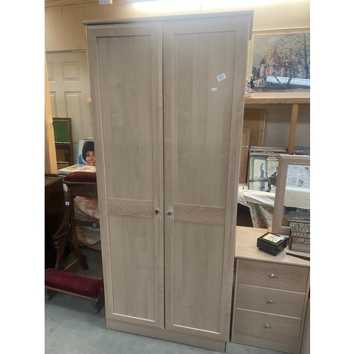 437 - A lightwood effect 3 piece bedroom suite, comprising of wardrobe, dressing table and stool and a bed... 