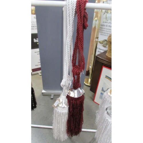 430D - A pair of red wine curtain tie backs with gem style embellishment and tassels [1 slightly lighter AF... 