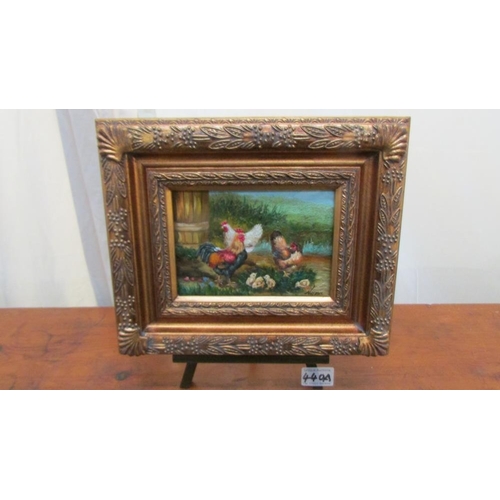 440A - A gilt framed study of a chicken