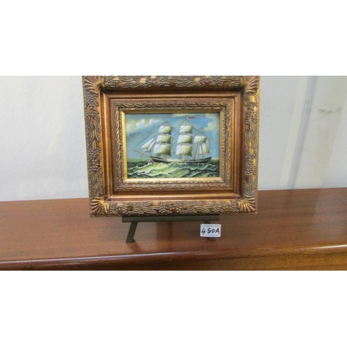 450A - A gilt framed study of a sailing ship