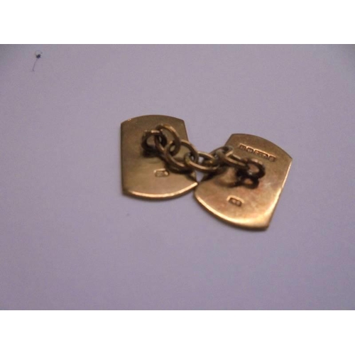 1006 - A pair of 9ct gold monogrammed cuff links, 5.84 grams.