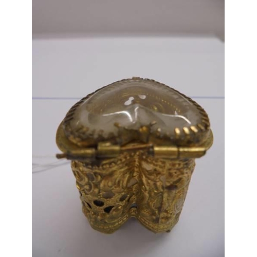 1008 - An ornate heart shaped ring box with glass top.