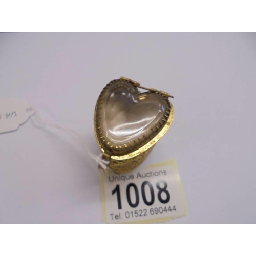 1008 - An ornate heart shaped ring box with glass top.