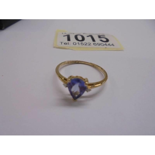 1015 - An 18ct gold pear shaped sapphire and diamond ring, size P, 1.38 grams.