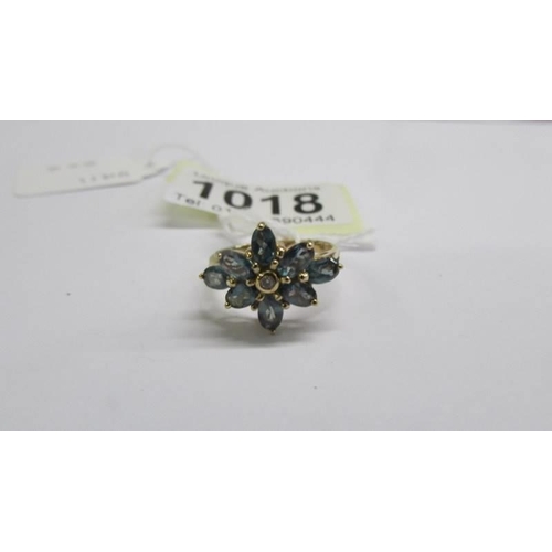 1018 - A white/yellow gold emerald and diamond cluster ring, size M half, 2.8 grams.