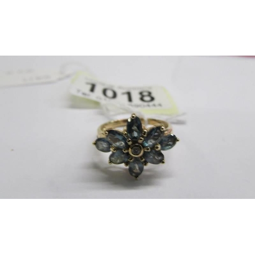 1018 - A white/yellow gold emerald and diamond cluster ring, size M half, 2.8 grams.