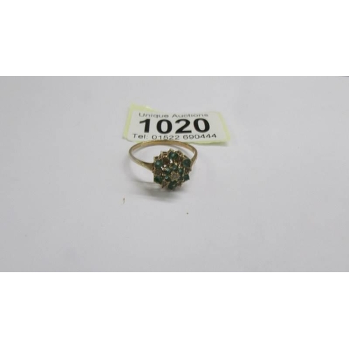 1020 - A 9ct yellow gold diamond and emerald cluster ring, size W. 2.46 grams.