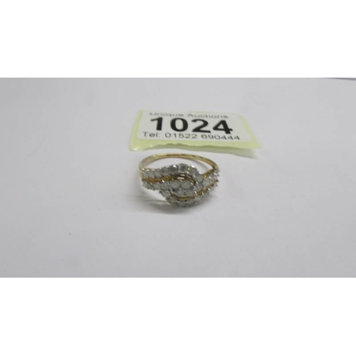 1024 - A yellow gold multi diamond swirl ring, size R half. 2 grams.