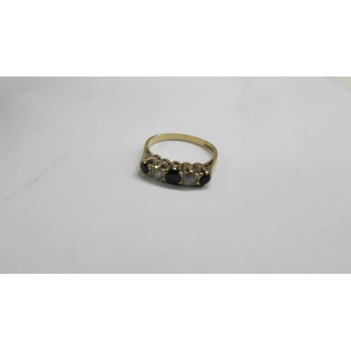 1029 - A 9ct gold sapphire ring size O, 2.2 grams and a silver ring, size J.