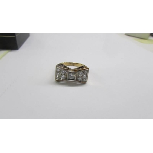 1030 - A yellow gold bow shaped ring (tests as 9ct), size P, 4.74 grams.