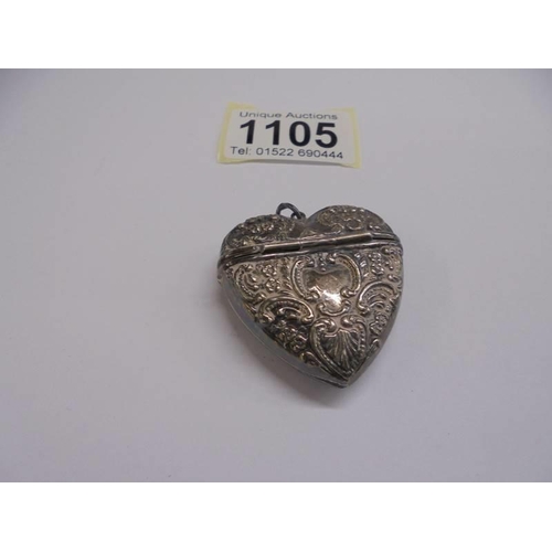 1105 - A heart shaped silver pill box/pendant.