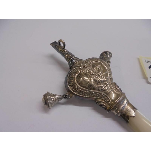 1106 - A 19th century silver and mother of pearl rattle with bells and whistle.