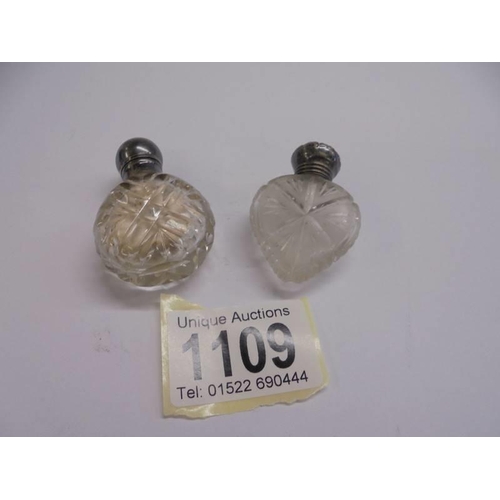 1109 - Two silver topped 19th century glass scent/smelling salt bottles.