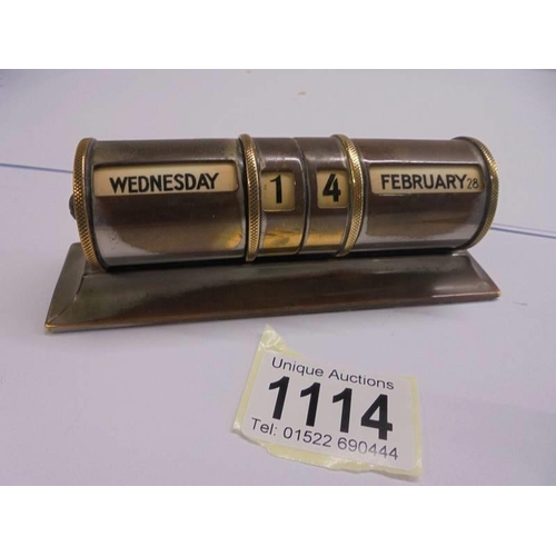 1114 - A silver perpetual desk calendar and a brass example.