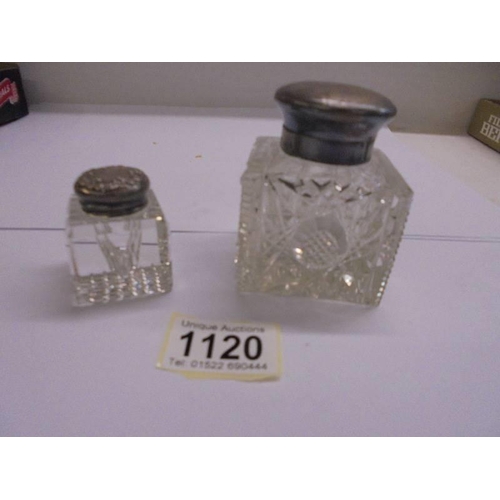 1120 - Two glass inwells with silver tops.