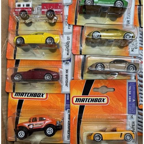 13 - A box of Matchbox cars in blister packs