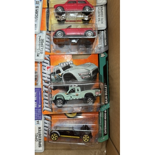 13 - A box of Matchbox cars in blister packs