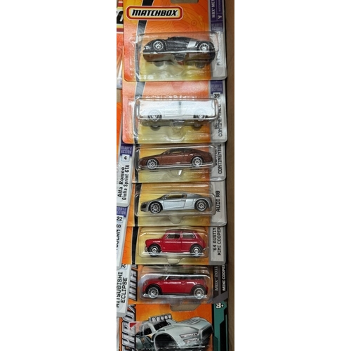 13 - A box of Matchbox cars in blister packs