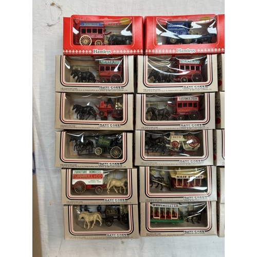 18 - A large box of Lledo horse drawn vehicles