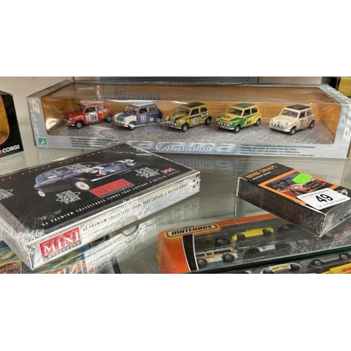 49 - A quantity of Mini models by Cararama, Vitesse etc and Mini collectable cards and a mug