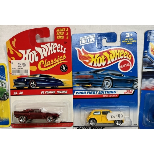 52 - 14 Hot wheels and 3 Hot Wheel Pro Racers in blister packs