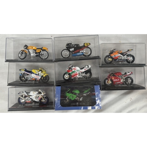 54 - 25 boxed motorcycle models by Atlas, Italeri etc and a wooden motorcycle jigsaw