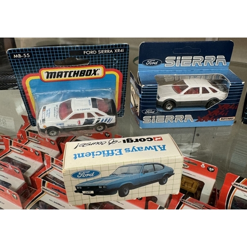 57 - 9 Ford Sierra models and Metro models by Matchbox and Corgi in blister packs and boxes