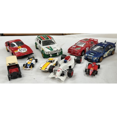 62 - A box of loose mixed scale and maker diecast and plastic vehicles including Hornby Hobbies slot cars