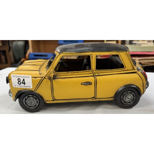 84 - A boxed resin Shudehill racing mini & a large pressed steel mini