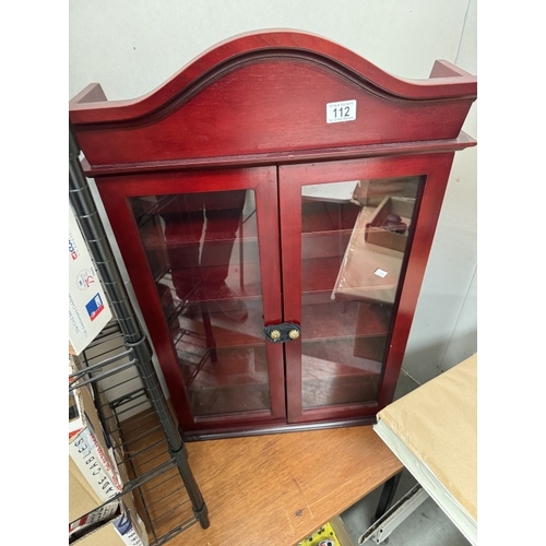 112 - A dark wood stained collectors display cabinet. Height 86cm, Width 55cm, Depth 15cm