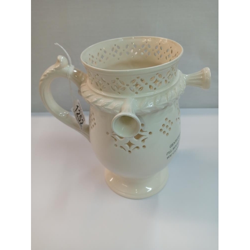 1252 - A Leedsware classical creamware puzzle jug. Height 20cm