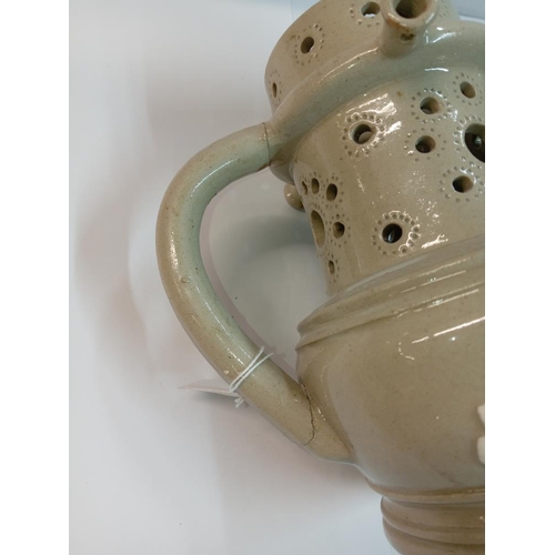 1253 - A 19th century stoneware jasperware puzzle jug, Height 20cm (handle repaired)