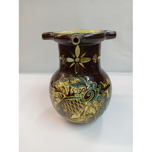 1257 - C H Brannam barum pottery puzzle jug. Height 17.5cm