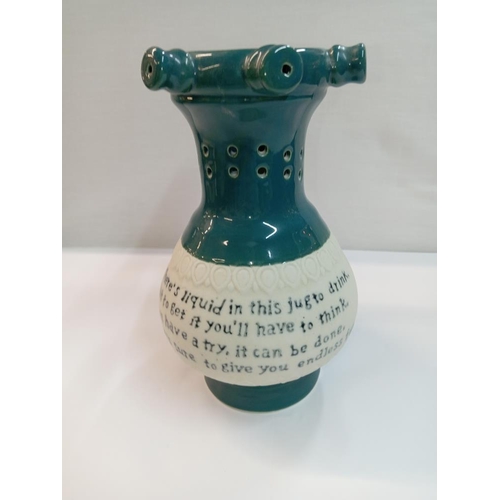 1262 - A Chinese pottery puzzle jug. Height 22cm