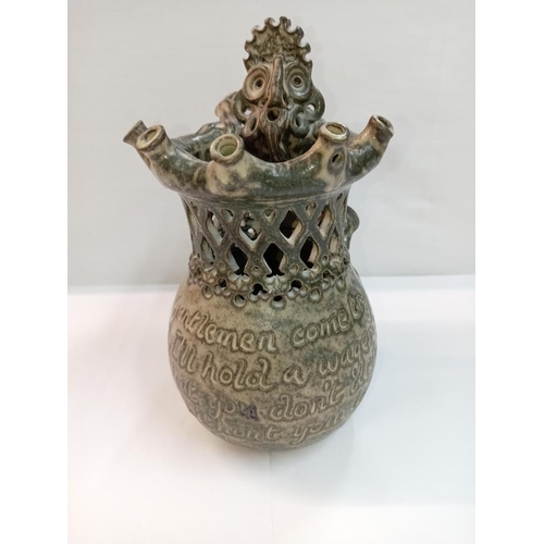 1263 - A Studio pottery puzzle jug with dragon handle. Height 22cm