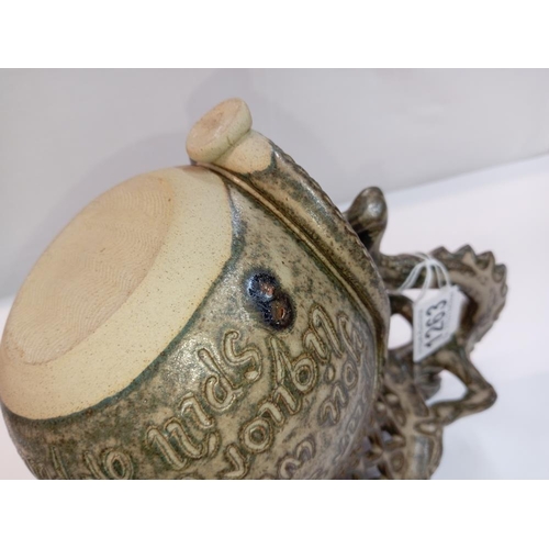 1263 - A Studio pottery puzzle jug with dragon handle. Height 22cm